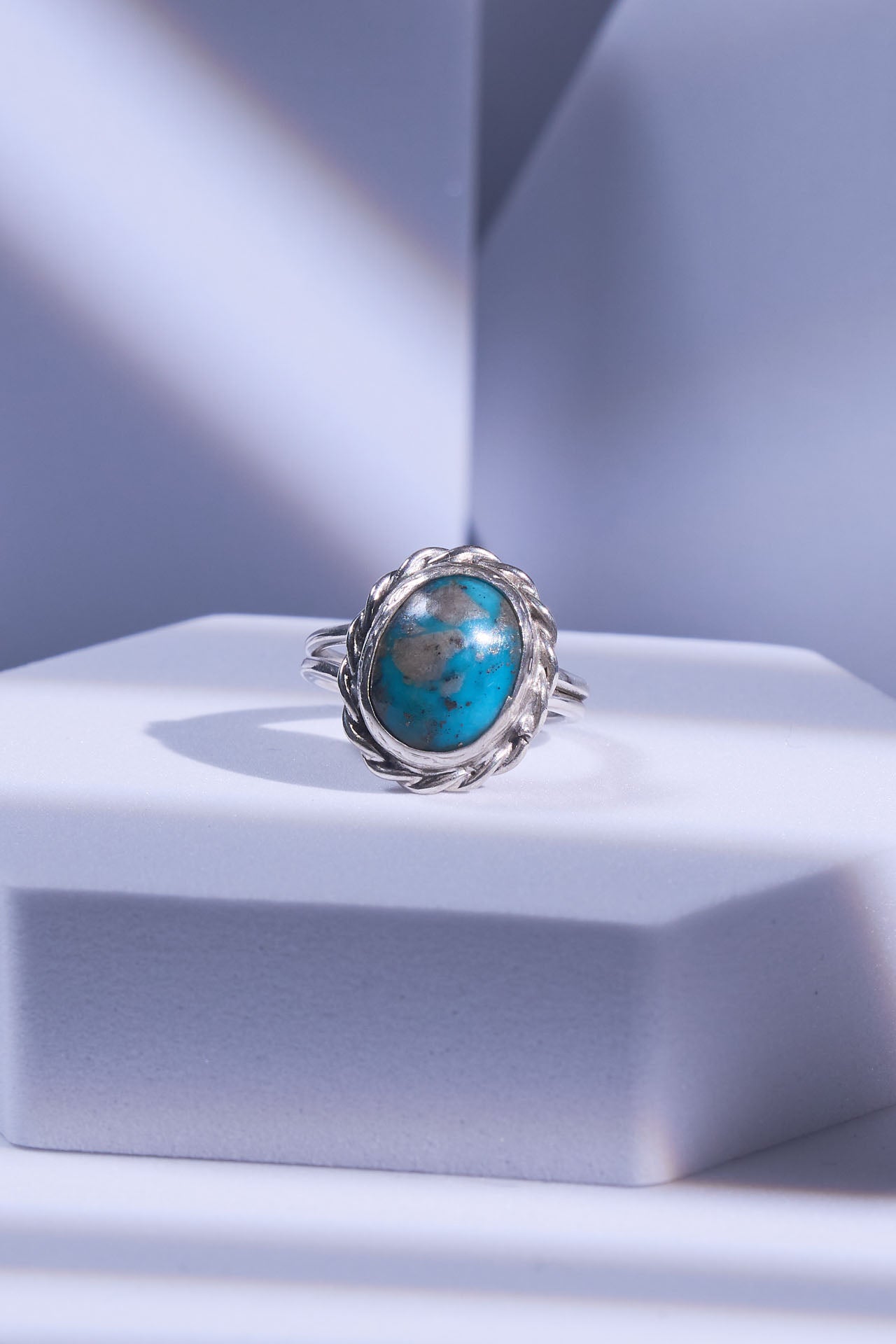 Silver ring with a natural turquoise stone with an arctic matrix inside. 