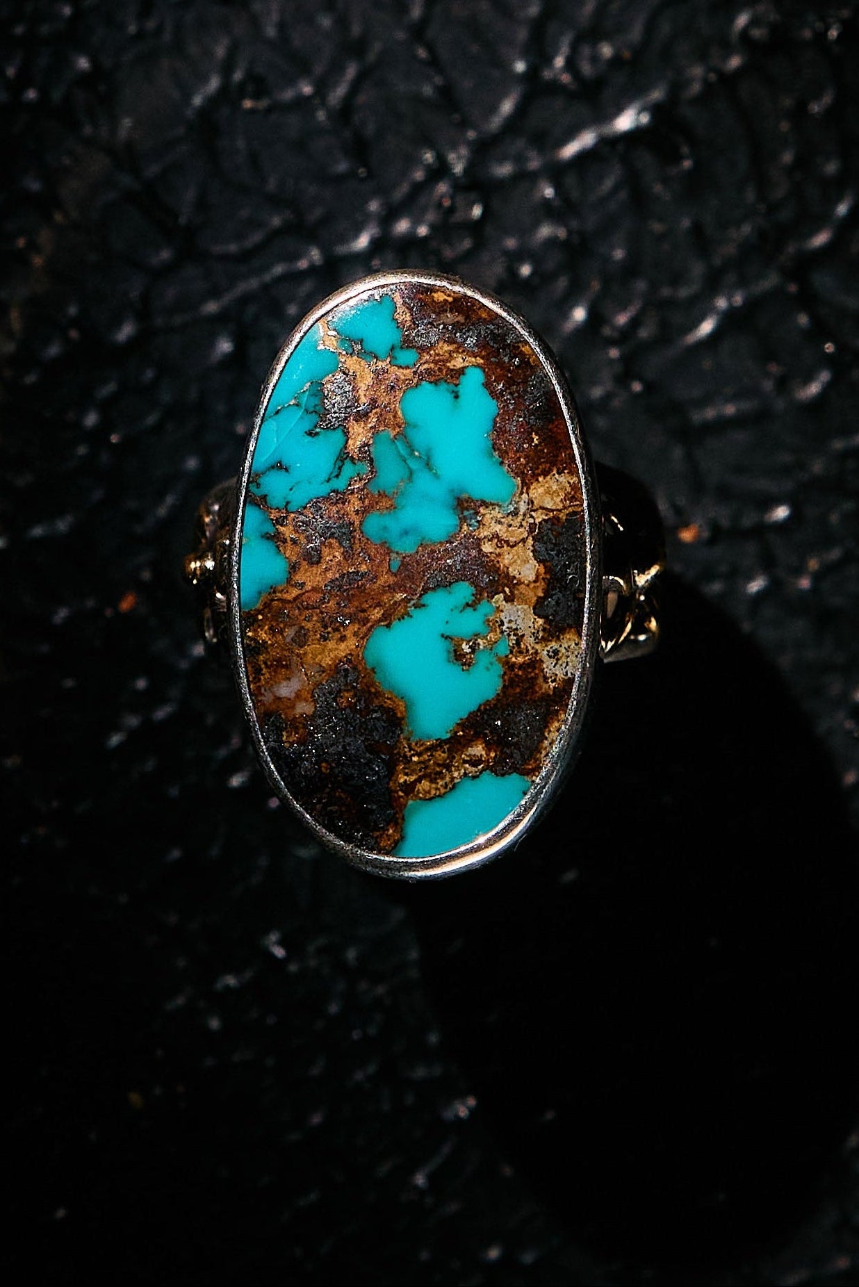 Turquoise stone ring with gold accents on a 925 silver band