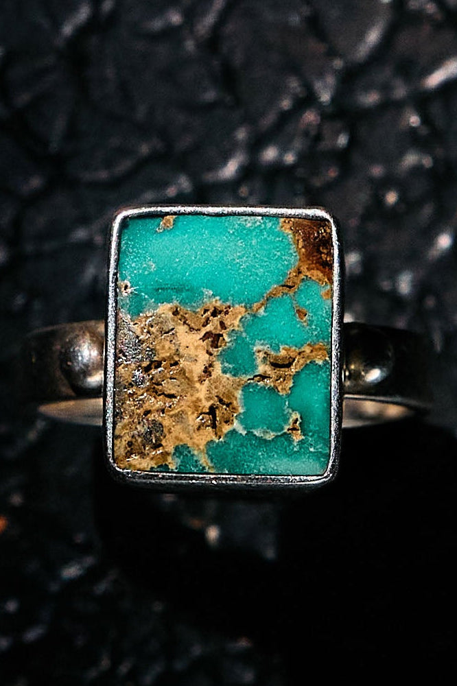 Turquoise ring with gold accents on a 925 silver band