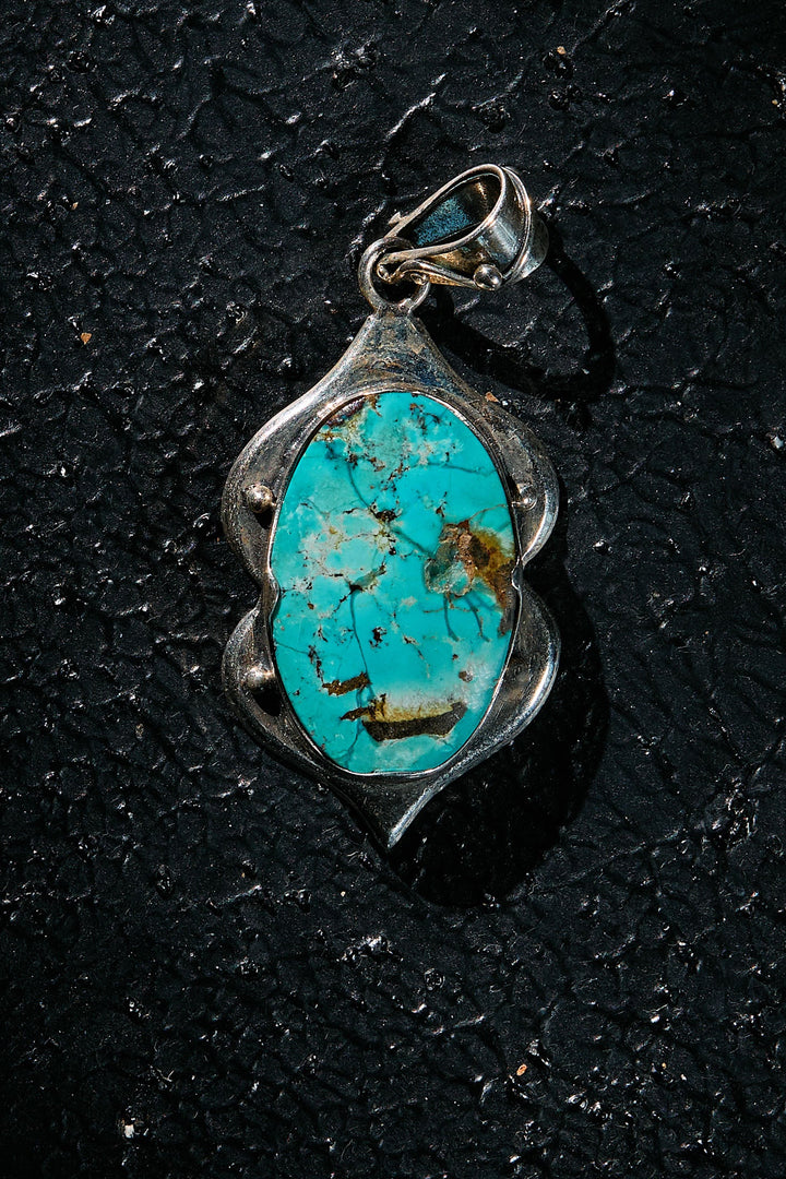 Turquoise pendant on 925 silver on a black background