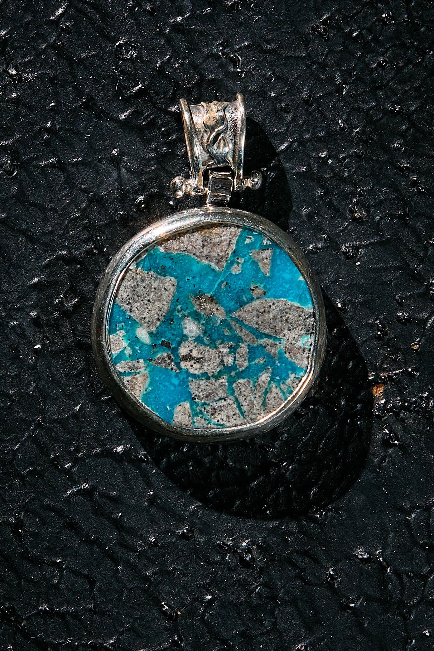 Pendant with blue and silver design in rare natural turquoise