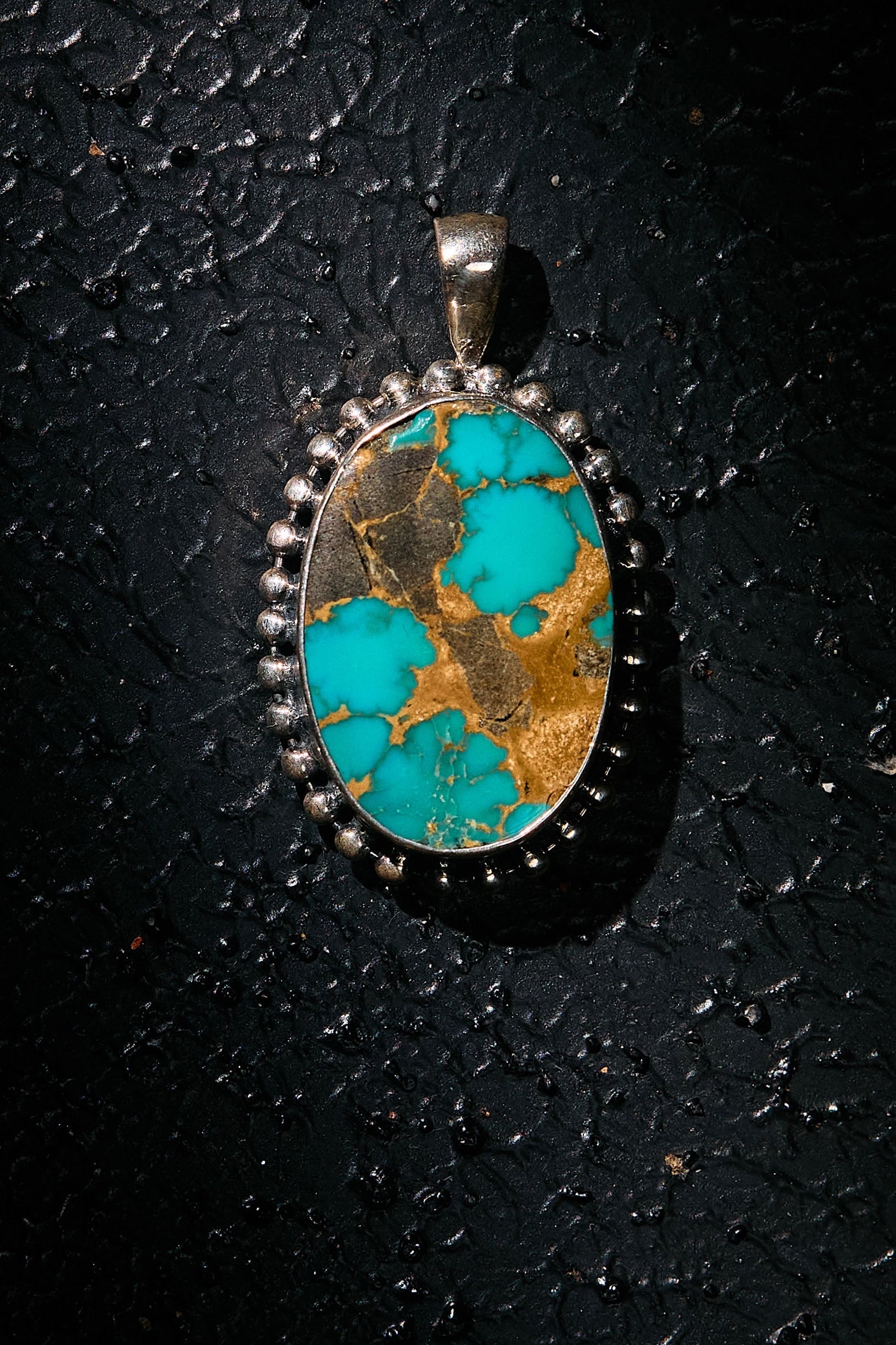 Turquoise stone pendant on silver