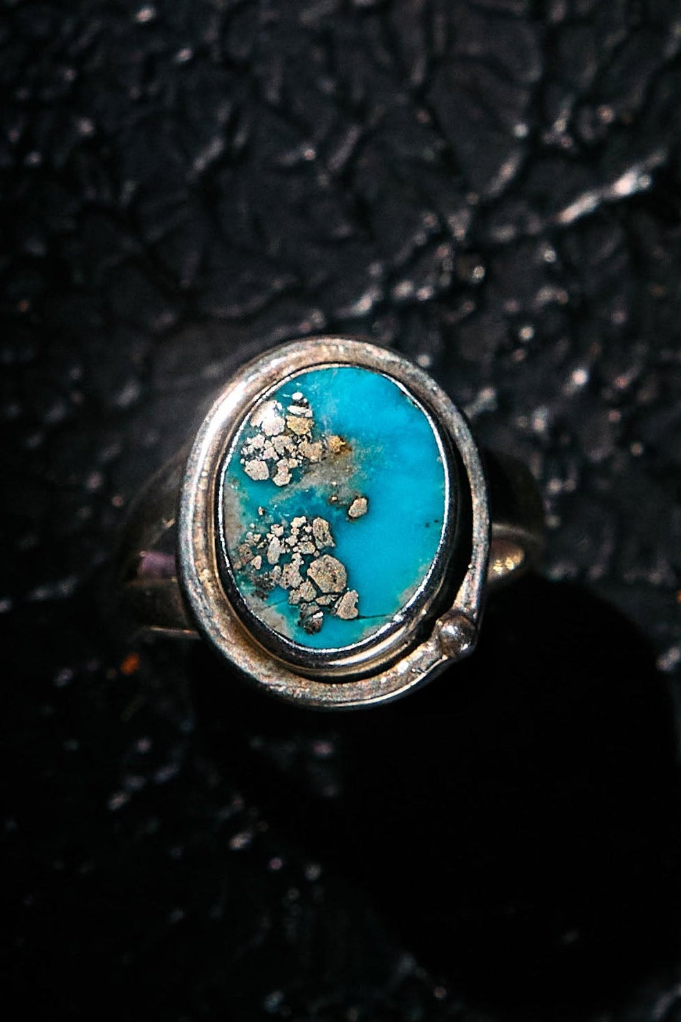 Ring with a rare turquoise stone with silver pyrite inside