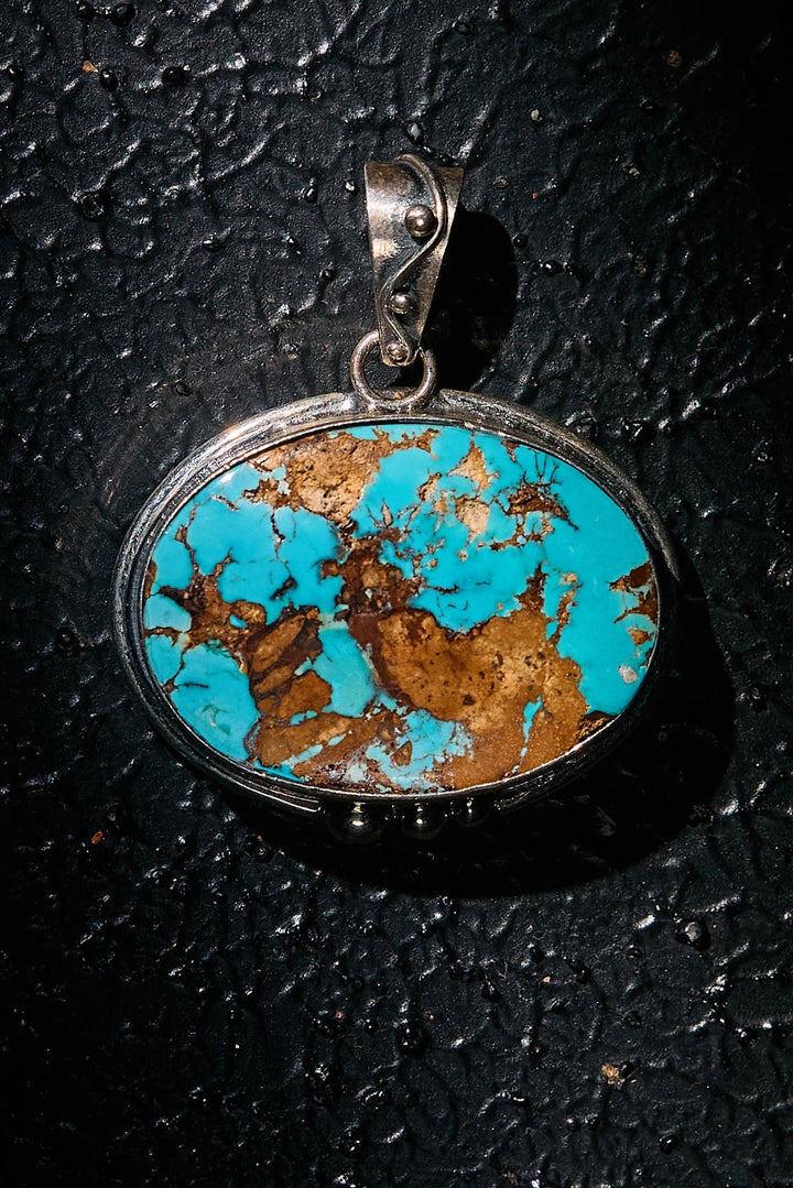 Turquoise pendant on 925 silver on a black background