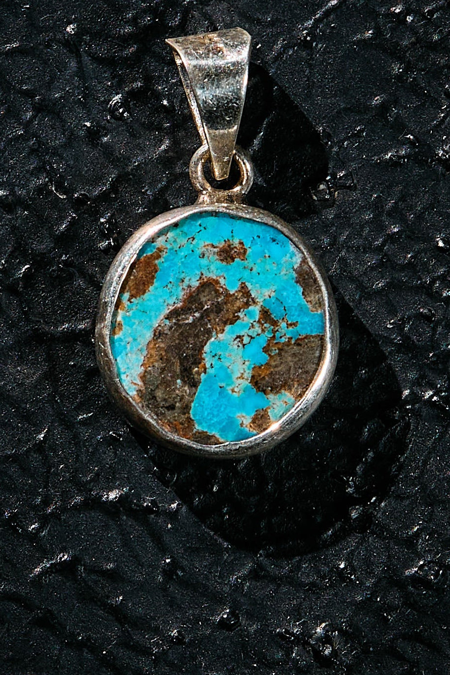 Turquoise pendant with silver setting with 2 spirit bear guides