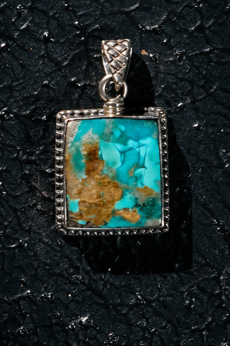 Rare Persian turquoise pendant with silver setting with an incredible wise feminine sage inside the matrix. 
