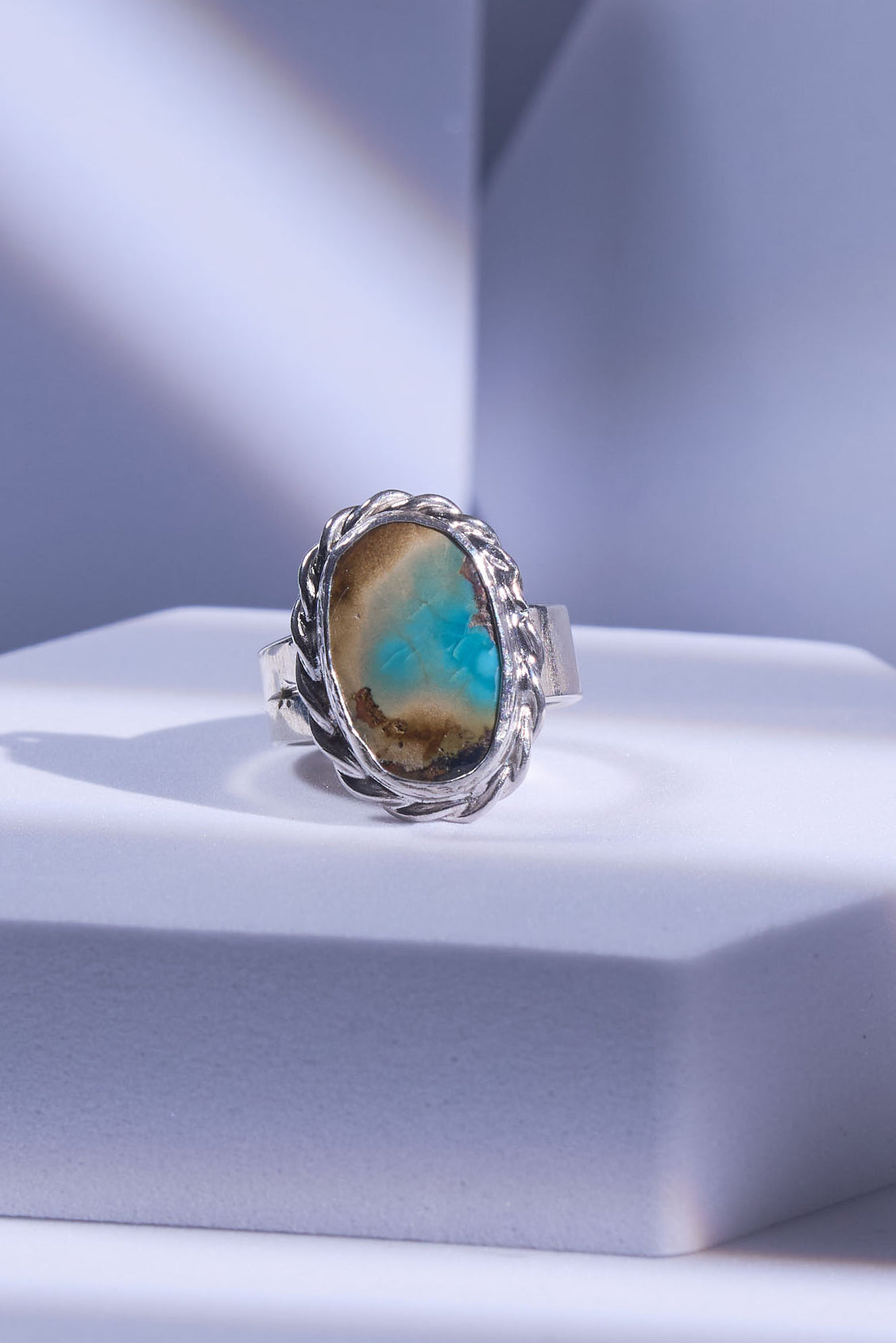 Silver ring with a natural turquoise stone with an incredible beach scene revealed in its matrix