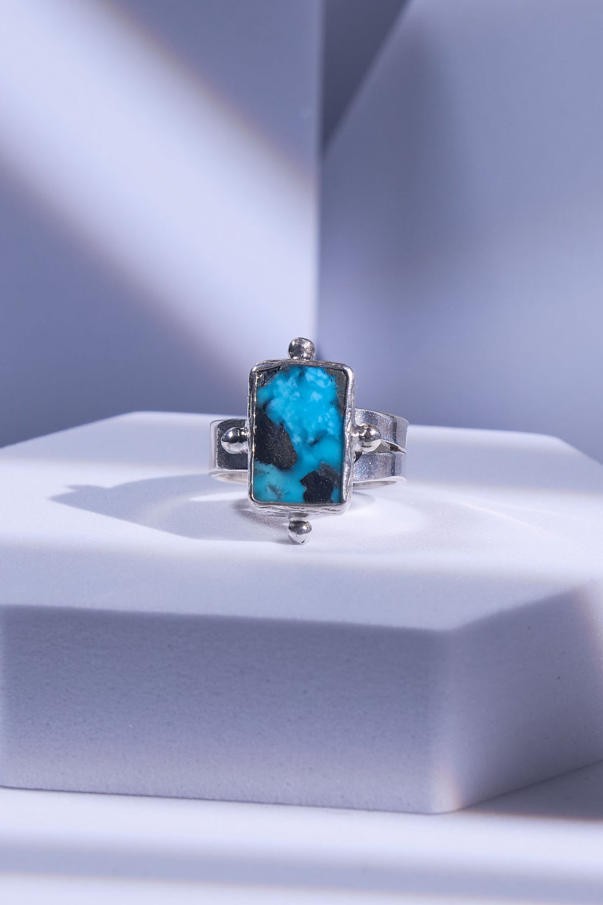 Silver ring with natural turquoise with silver figured naturally embedded onto its matrix